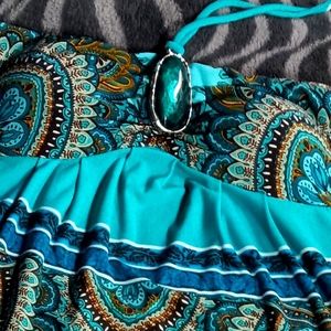 Multi colored strapless dress with a tie around the neck